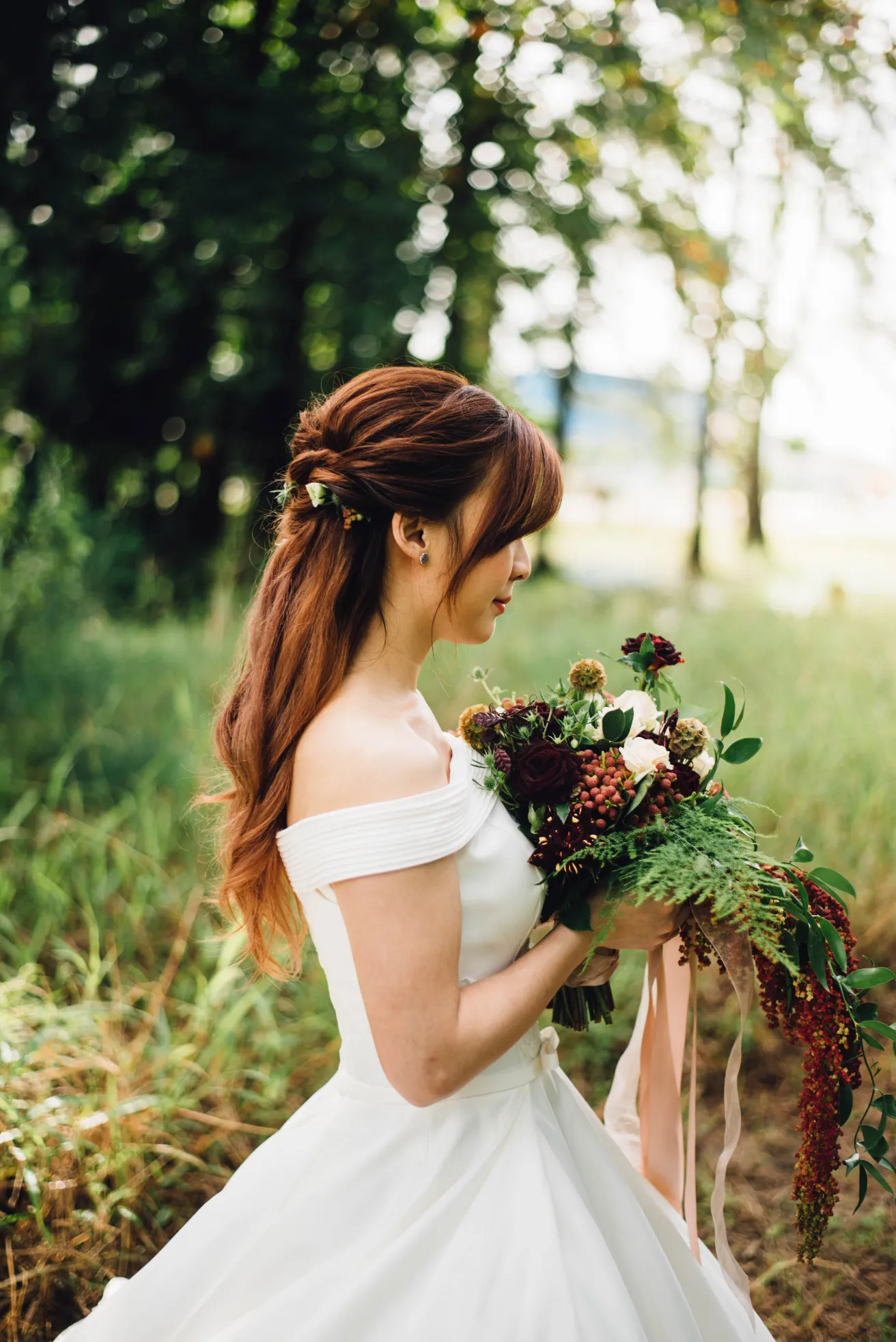 bride holding floral bouquet