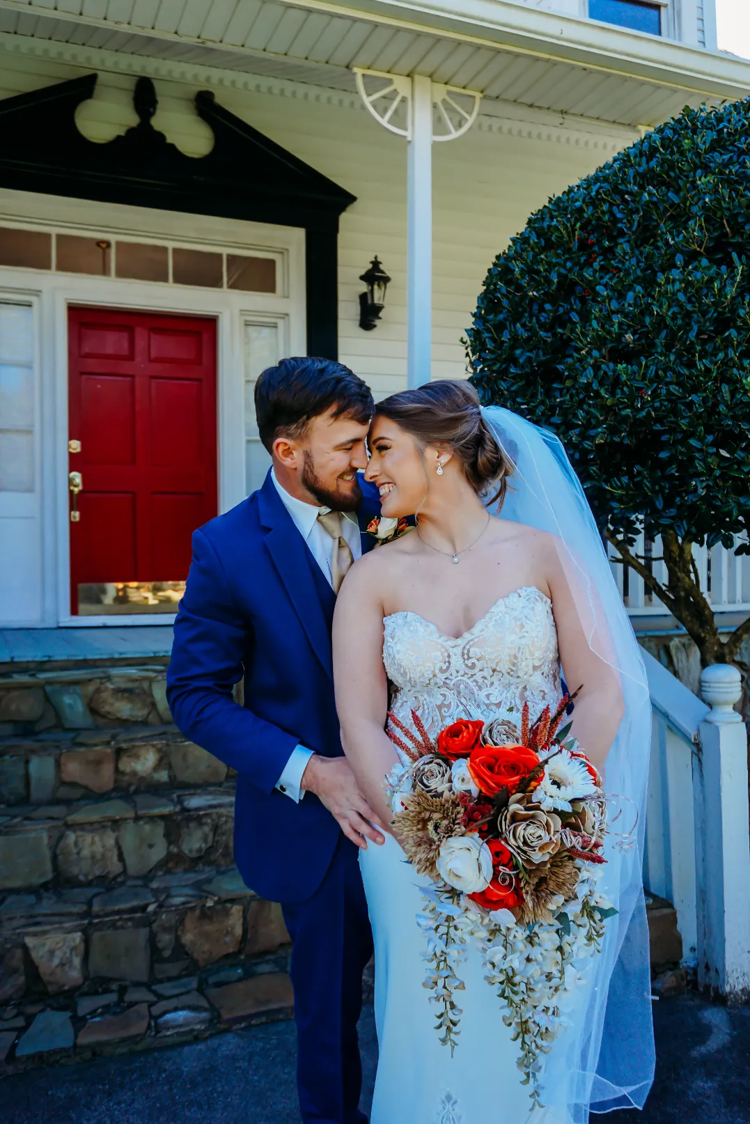 couple in front of main house