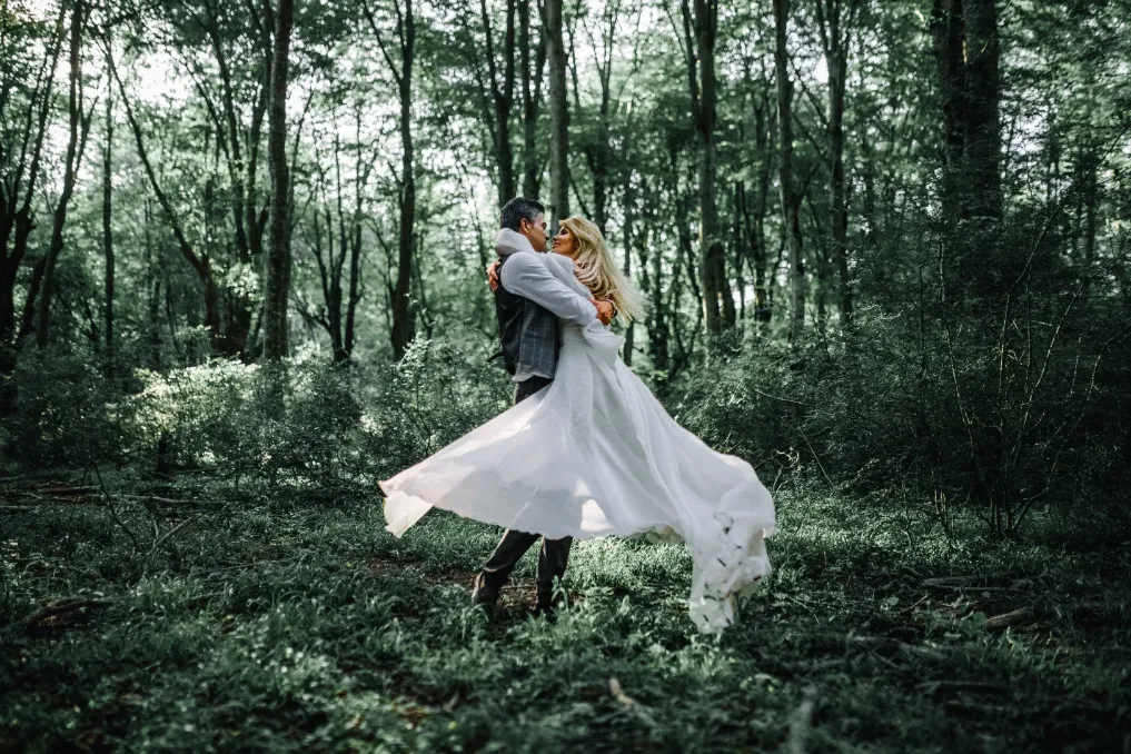 couple in the forest frolicking