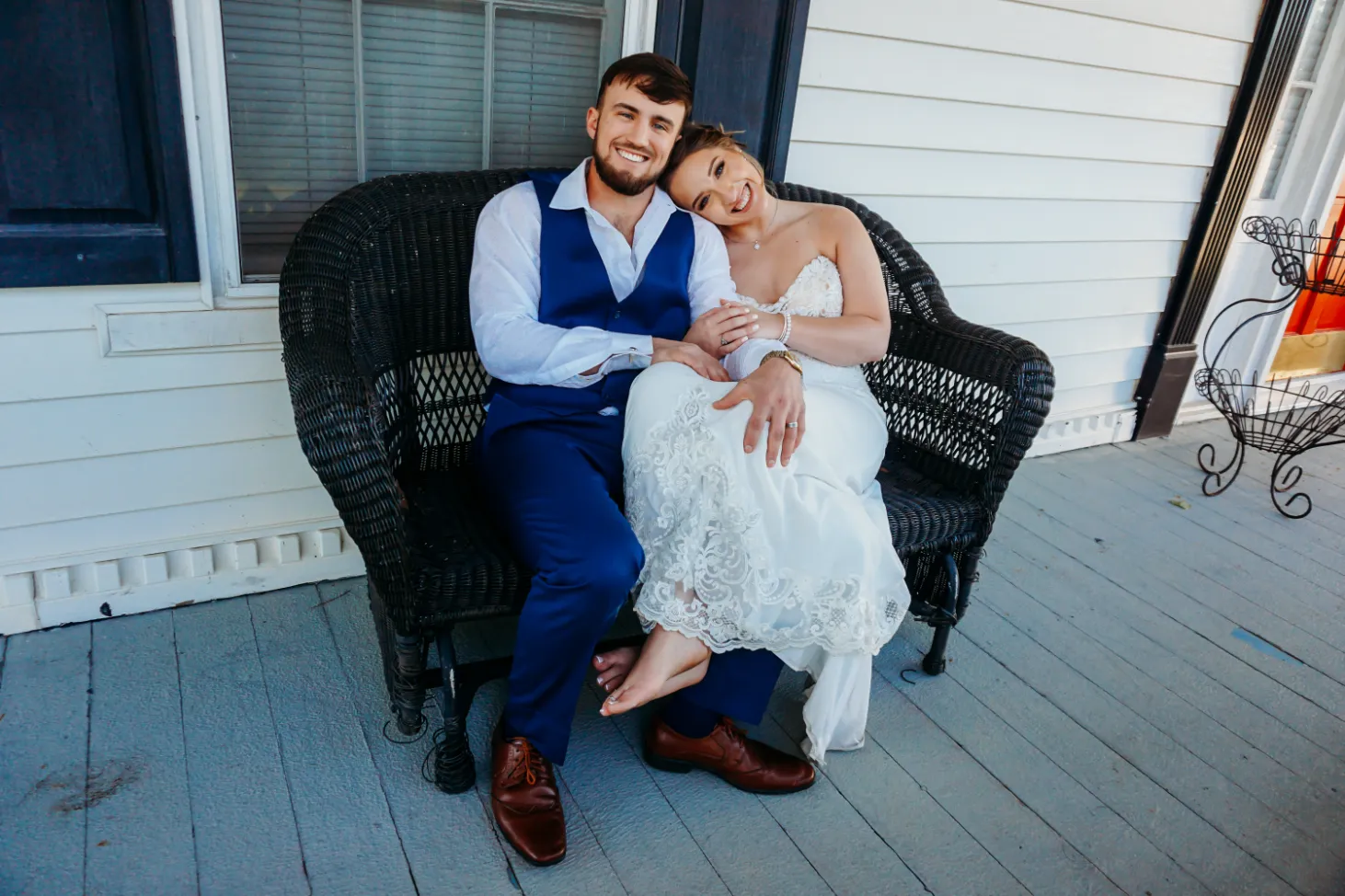 happy couple sitting on porch